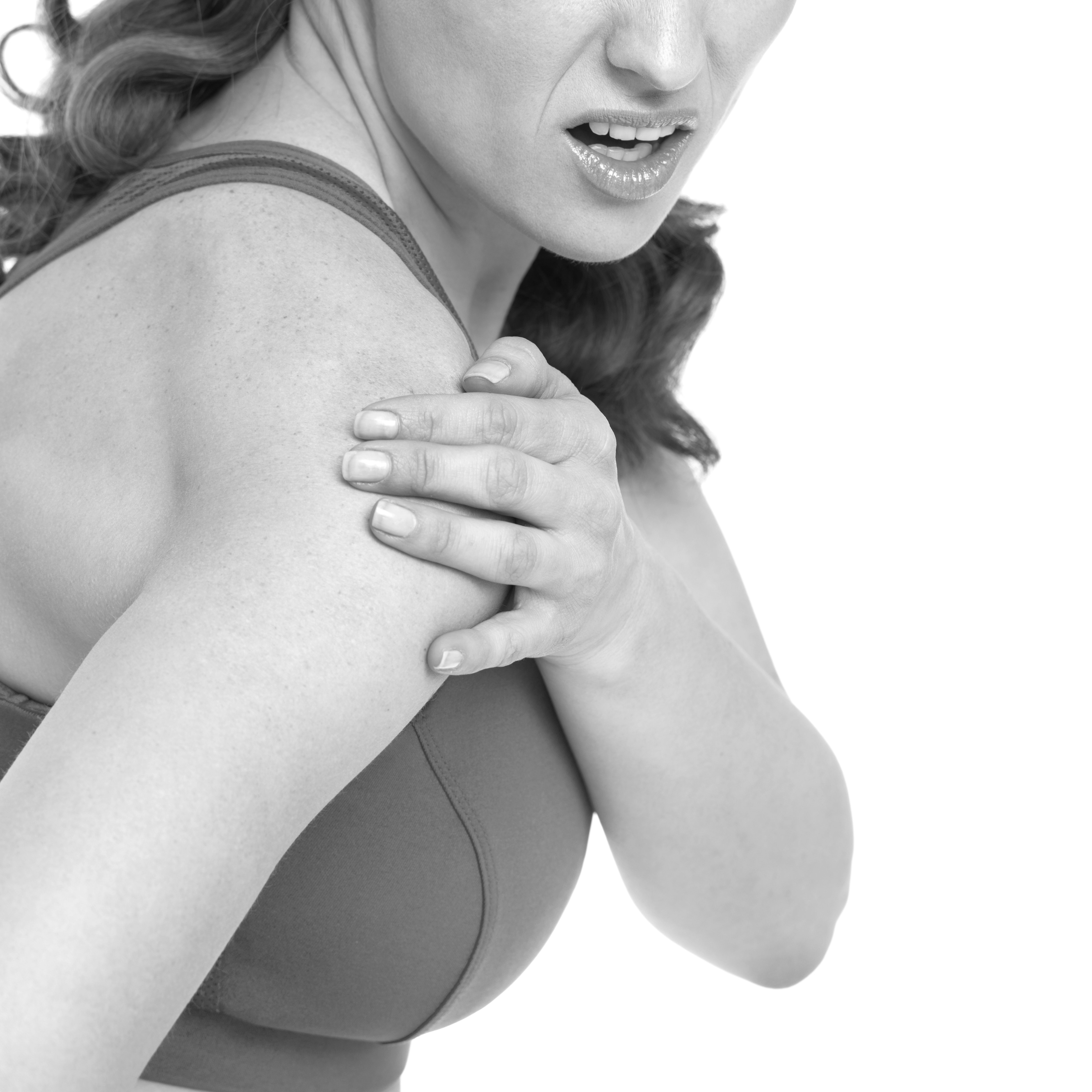 woman with sports clothing holding shoulder